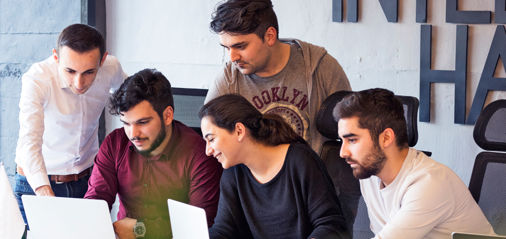 colleagues-working-project-discussing-details